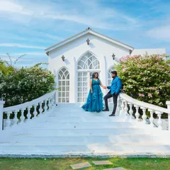 A grand entrance at our European white villa set. The sweeping staircase and blooming bougainvillea create a perfect fairytale setting for a pre-wedding shoot.