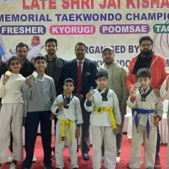 The team posing together at a memorial championship. We participate in events as a unified team, representing the spirit of Prahar.