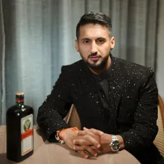 A confident groom ready for his cocktail night. The grooming is subtle, ensuring he looks sharp and polished in person and on camera without looking like he's wearing makeup.