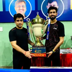 Our Head Coach, Ravindra Singh, with the winner's trophy from the Agra Badminton Premier League. Our coaching staff consists of active, high-performing players who bring current, real-world tournament experience to our students.