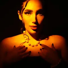 A conceptual makeup look using dramatic lighting. Makeup is like jewelry for the face, and here the play of light and shadow highlights the structure and form.