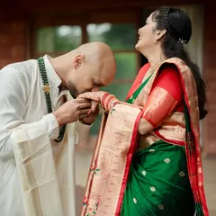 A moment of pure adoration and tradition. We focus on capturing gestures like these that speak volumes, blending chivalry with the rich textures of heritage attire.