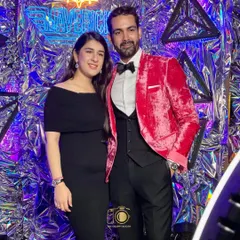A stylish couple posing at the Maverick-themed gala. We provide a high-end experience that matches the sophistication of your corporate function.