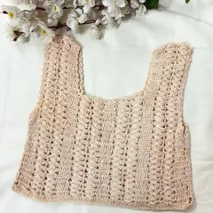 The same sleeveless crop top design shown in a soft, neutral beige color. We can create our designs in any shade you prefer.