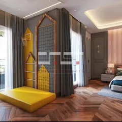 A dream room for an active child, this space includes a fun play area with a mini basketball hoop and a climbing wall, seamlessly integrated with the bedroom's stylish design.