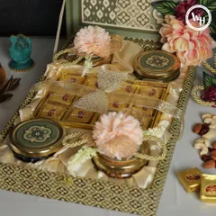 I designed this intricate gift box with traditional motifs for Diwali. It opens up to reveal an assortment of Indian sweets and premium dry fruits, perfect for corporate clients.