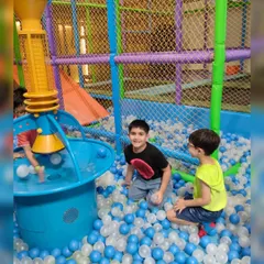 Diving into fun in our massive ball pit. It's one of the most popular spots in our play zone, complete with a ball fountain for extra excitement.