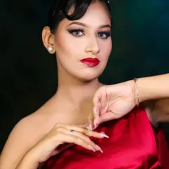 This portrait showcases a complete party-ready look, from the sleek hair to the polished makeup and nails.