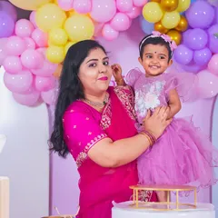 A heartwarming close-up of mother and daughter, capturing a moment of affection and a happy smile.