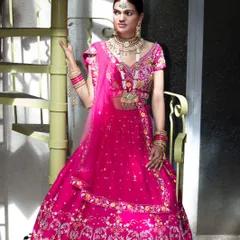 For this designer bridal lookbook, I focused on the vibrant color and intricate embroidery of the lehenga. The studio setting with the spiral staircase adds a unique architectural element to this fashion portrait, making the garment stand out.