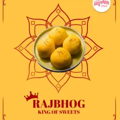 This is Rajbhog, the king of sweets. Soaked in saffron-infused syrup, this royal dessert is a soft and utterly divine treat for any special occasion.