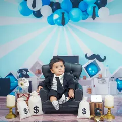 The Boss Baby is in charge! This fun theme includes a tiny suit, a leather chair, and bags of money for a hilarious and memorable shoot.