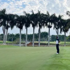Surveying the green from the fairway, a key part of course management. I teach my students how to assess the landscape and plan their approach shots for the best possible outcome.