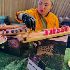 Artistry in every roll. My chef is seen here carefully plating Prawns Tempura sushi, showcasing the precision and fresh ingredients that define my Pan-Asian cuisine offerings.