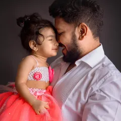 A sweet nose-to-nose moment between a father and his little girl. The dark background and their bright smiles make this an incredibly heartwarming shot.