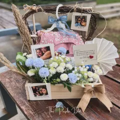 The full view of the bespoke birthday hamper, showcasing how I integrate client-provided gifts like clothing into a cohesive and elegant presentation.