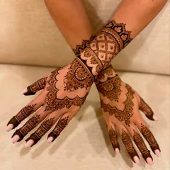 A beautiful and dense engagement mehendi with scalloped borders, detailed mandalas, and fine line work for a rich, full look.