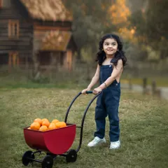A little boy on a mission with his wagon. Outdoor sessions are perfect for toddlers, giving them space to move, play, and show off their personalities.