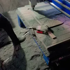 A CNC machine at work, cutting an intricate design onto an MDF sheet for a wardrobe shutter. This technology allows for incredible precision and customization.