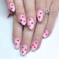 Tiny red hearts scattered across a sheer pink base. This is a sweet and simple design, perfect for Valentine's Day or any time you want to wear your heart on your nails.