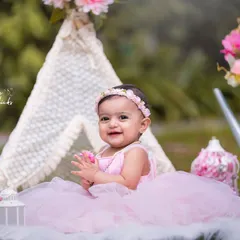 Another happy moment from the outdoor boho-themed shoot. The natural greenery provides a beautiful contrast to the pink styling, and the soft sunlight creates a warm and gentle glow.