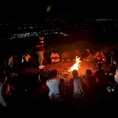 After a day of trekking, we gather around the campfire. This is where we share stories, play games, and strangers start to feel like old friends. It's the heart of our trips.
