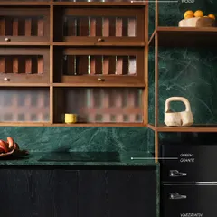 A detail shot from our studio pantry, where natural oil-treated oak shutters meet a rich green granite countertop. This combination of materials creates a feeling of quiet warmth and understated refinement.