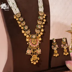 We present the Rajnitya Haar, a woven anthem of gold and tradition. This ceremonial treasure features divine motifs and intricate nakashi work, strung with lustrous pearls, embodying generational pride. It is a bridal companion designed not just for a wedding, but for a lifetime of legacy.
