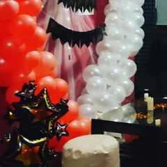 A glimpse of another one of our decoration themes, showing how we can use different color balloons and banners to completely change the look of the space.