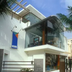 We transformed a typical bungalow in Bengaluru into a distinctive retail store for Yamini, a home furnishing brand. By adding a modern, curved glass facade, we opened up the building to the street, creating an inviting and contemporary identity for the brand.