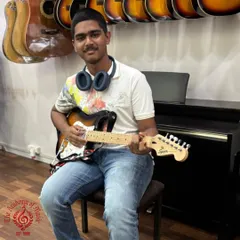 Meet our rockstar, Jose Fernandes, who is mastering the electric guitar with us. We offer comprehensive lessons for acoustic and electric guitar, guiding students through Trinity Rock and Pop exams and helping them find their unique sound.