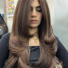 The front view of this expertly executed layered cut and blowout. It’s a timeless style that is both glamorous and easy to manage.