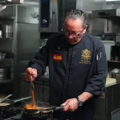 In my kitchen, every dish is prepared with cariño, or love. Here, I am preparing a sauce, ensuring that every ingredient speaks of its Spanish heritage and contributes to a memorable flavour.