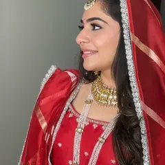 A side profile of Rashmi's Anand Karaj makeup, showing the clean winged liner and soft, glowing skin that is perfect for a morning wedding ceremony.
