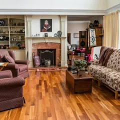For this traditional living room, I selected a classic wood floor with natural grain variations. It provides a perfect, warm foundation for classic furniture and creates a cozy, lived-in atmosphere around the fireplace.