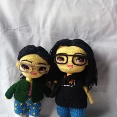 A custom doll pairing I made for a client, capturing their likenesses from photos, including their distinct hairstyles and glasses.