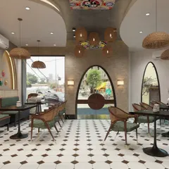 The interior of Tarcurry Cafe, with its patterned flooring, woven light fixtures, and comfortable seating, creates a warm and culturally rich dining experience.