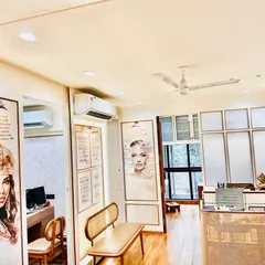 A view of my clinic's reception and waiting area. I believe in a holistic approach to wellness, and the calming and professional ambiance of my clinic is designed to make you feel comfortable and cared for from the moment you walk in.