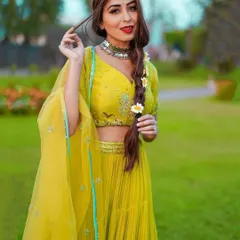 For this festive Baisakhi look, I styled influencer Ruma Sharma in a vibrant lime-green lehenga. The styling focuses on a fresh, modern Indian aesthetic, complete with a braided hairstyle and delicate floral details.