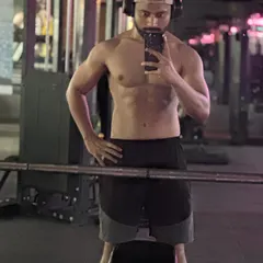 A mirror selfie showing clear progress in muscle definition and tone. This is the kind of satisfying result that comes from a dedicated training plan and consistent effort.