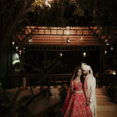 A nighttime portrait under a beautifully lit gazebo. I use the warm, ambient lighting to create a romantic and intimate atmosphere, capturing the couple in their stunning wedding attire after the ceremony.