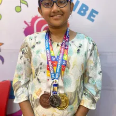 I am so proud of my student Aayushi, a chess champion from our academy. Here she is with her medals after winning first place at the Khel Mahotsav Chess Tournament. Her dedication is an inspiration to all of us.
