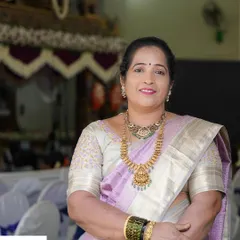 A happy and confident client. The makeup is subtle, with a focus on brightening the complexion and adding a soft touch of color to the lips and cheeks.