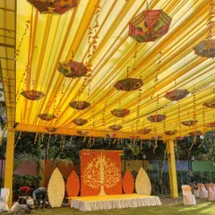A Haldi ceremony should be full of joy and color. We created this vibrant canopy with bright yellow drapes and decorated it with traditional Rajasthani umbrellas and marigold garlands, setting the perfect mood for the celebration.