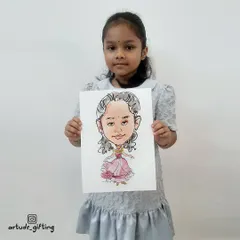 A sweet little girl with her princess caricature. These custom drawings make for wonderful and personal return gifts at birthday parties.