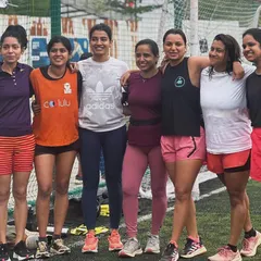 The strong women of our running community posing together after our 'Move for the Planet' event. We run together, we play together, and we support each other.