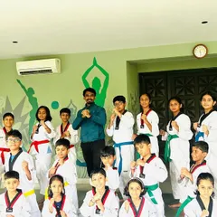 A group photo with my students. Seeing them grow in discipline, strength, and confidence is my biggest achievement as a coach.