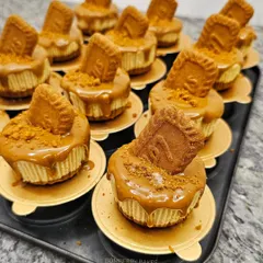 A tray of freshly made Biscoff mini cheesecakes, ready for a party.