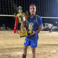 A player from our academy proudly holds the winner's trophies after a successful All India Tournament. This is the result of countless hours of practice and commitment.