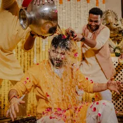 When the groomsmen decide it's their turn! Capturing the groom getting lovingly doused by his friends is always a highlight.